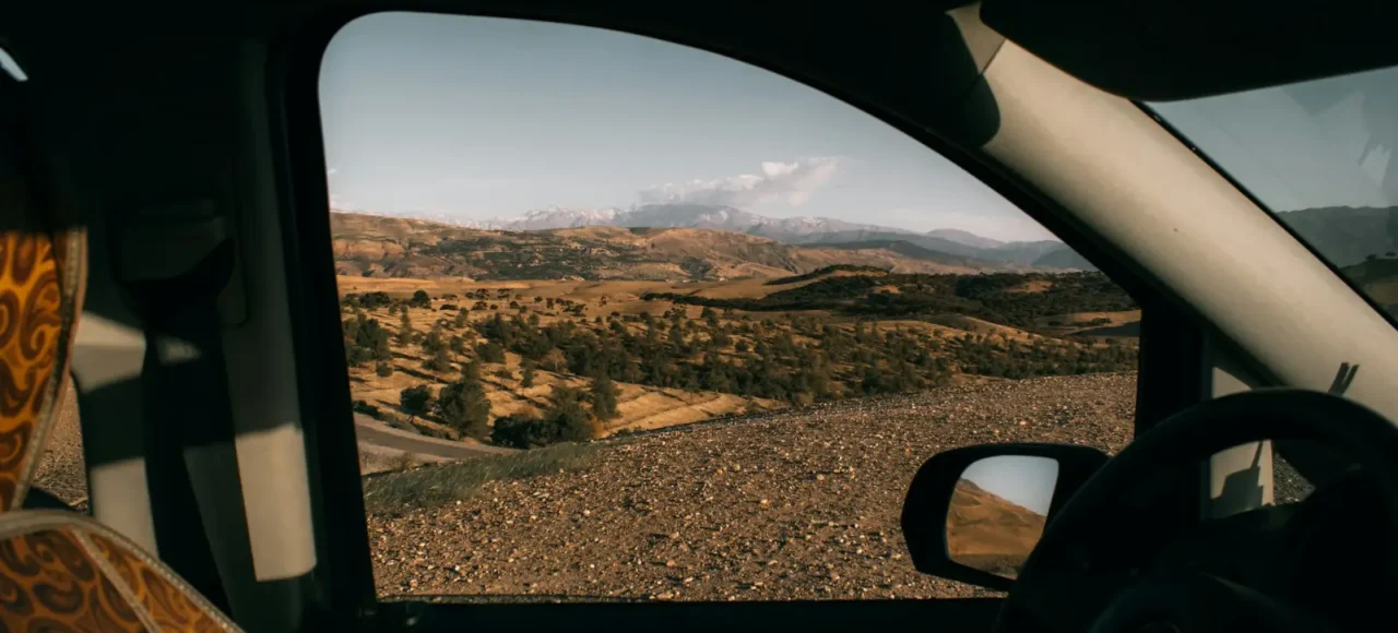 Mountain landscape seen from a car window
