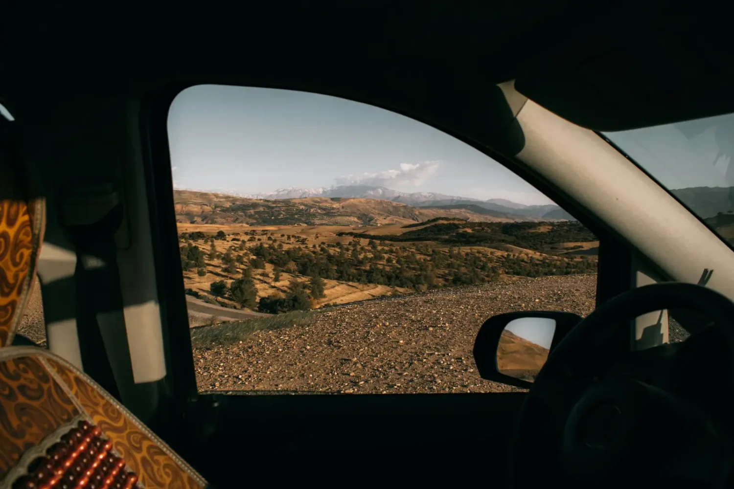 Mountain landscape seen from a car window