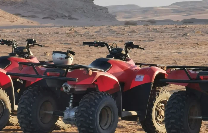 Quad bikes parked on the sand