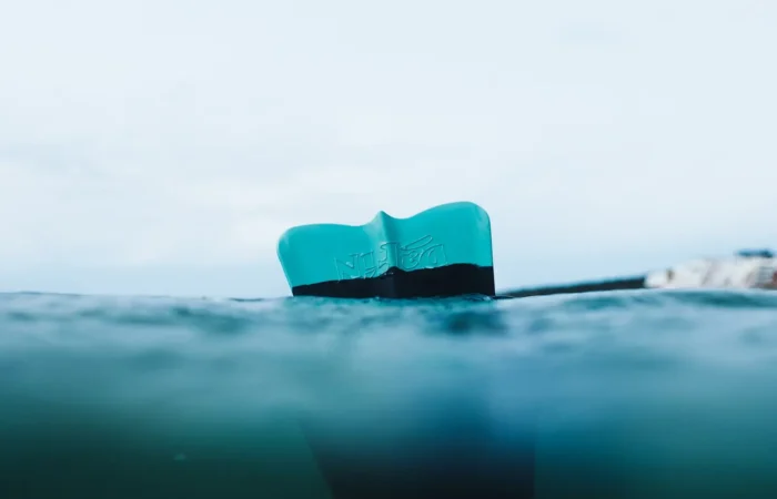 Surfboard in turquoise water off Taghazout